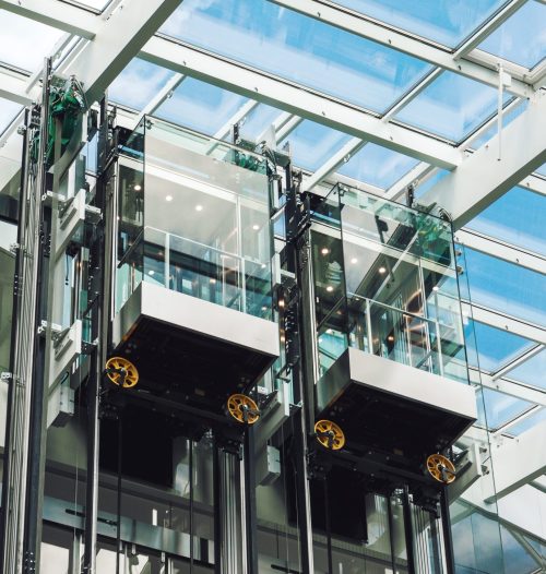 Modern elevator glass cabins in a contemporary business center